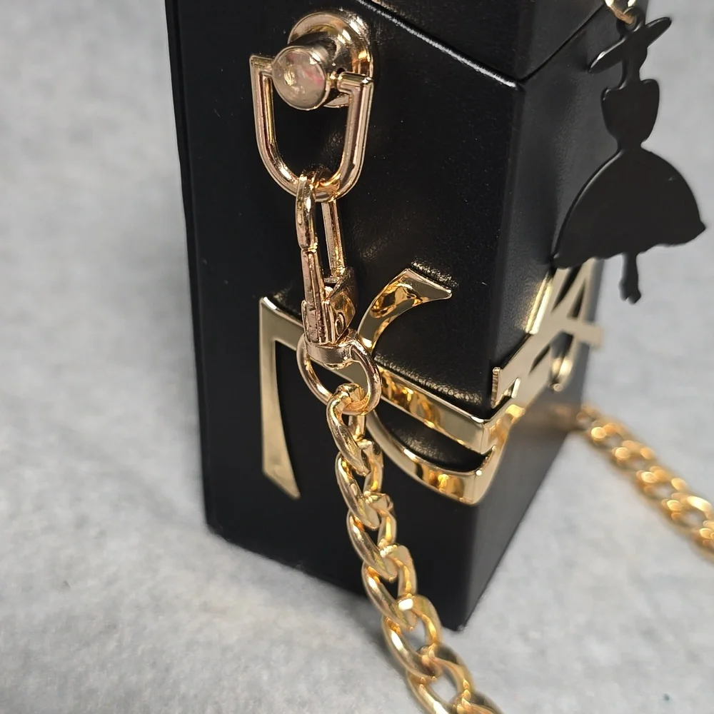Yves Saint Laurent Beaute Black and Gold Mini Bag
